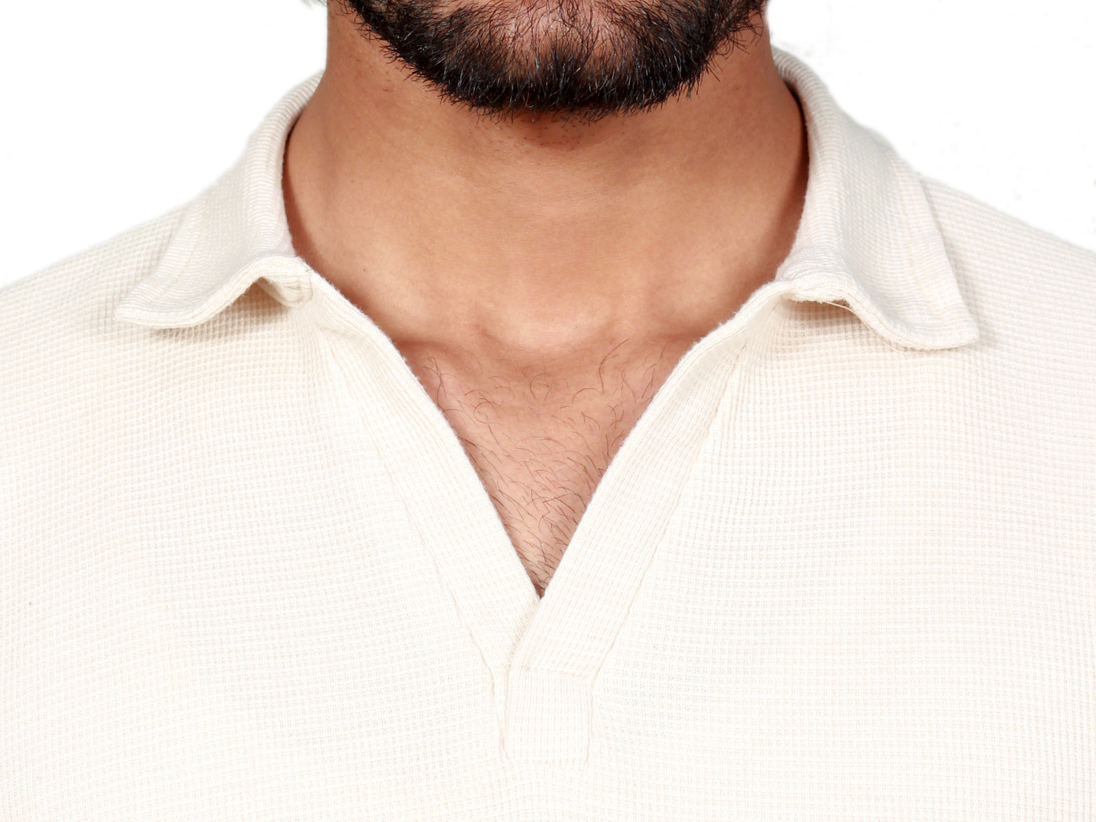 Closeup view of a beige polo shirt for men in Pakistan showing fabric detail and stitching