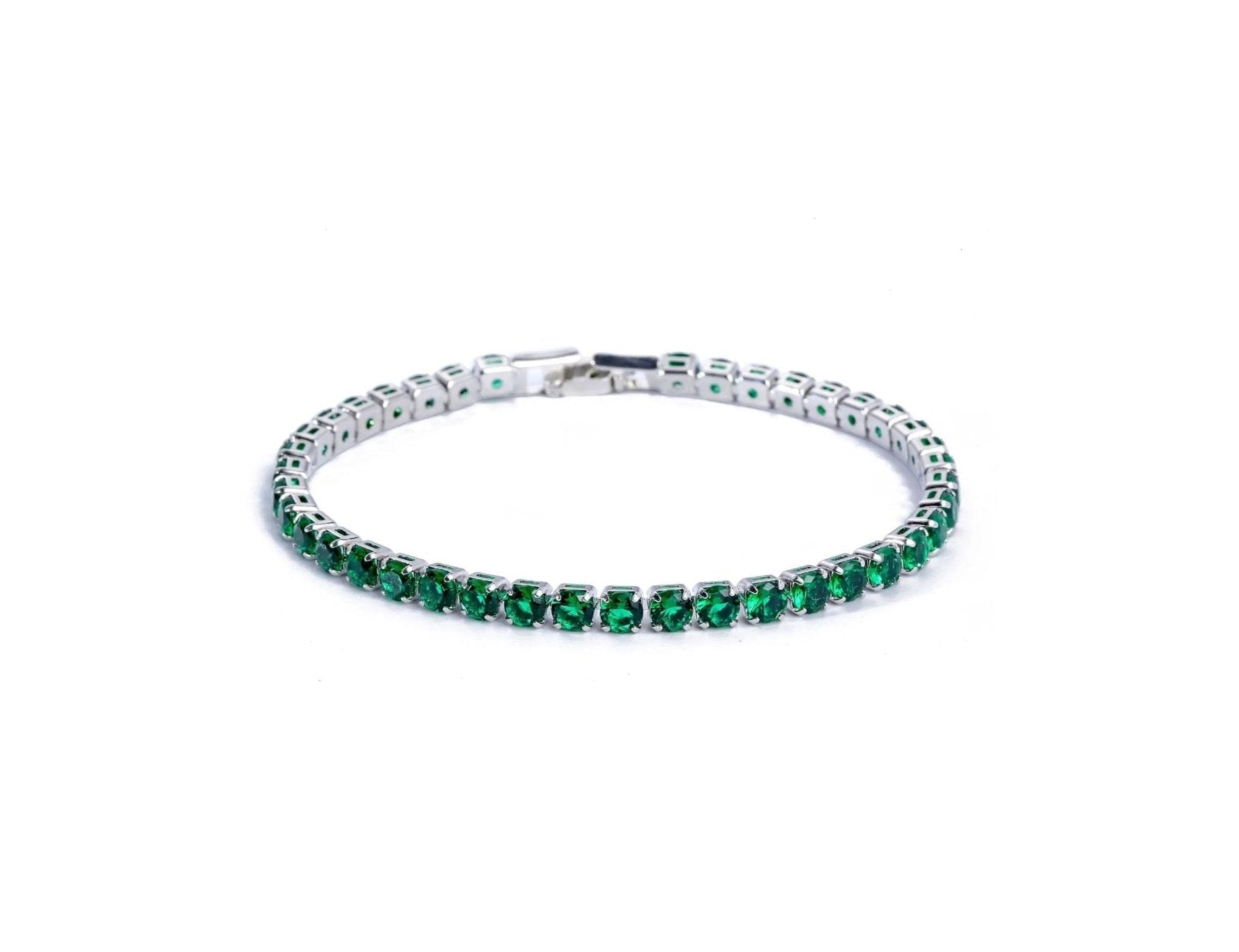 Vert green tennis bracelet on a white background, featuring neatly set green stones in a smooth line design with silver frame.